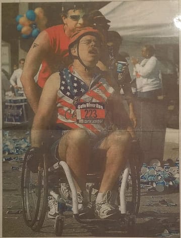 John Waller running a marathon in a wheelchair